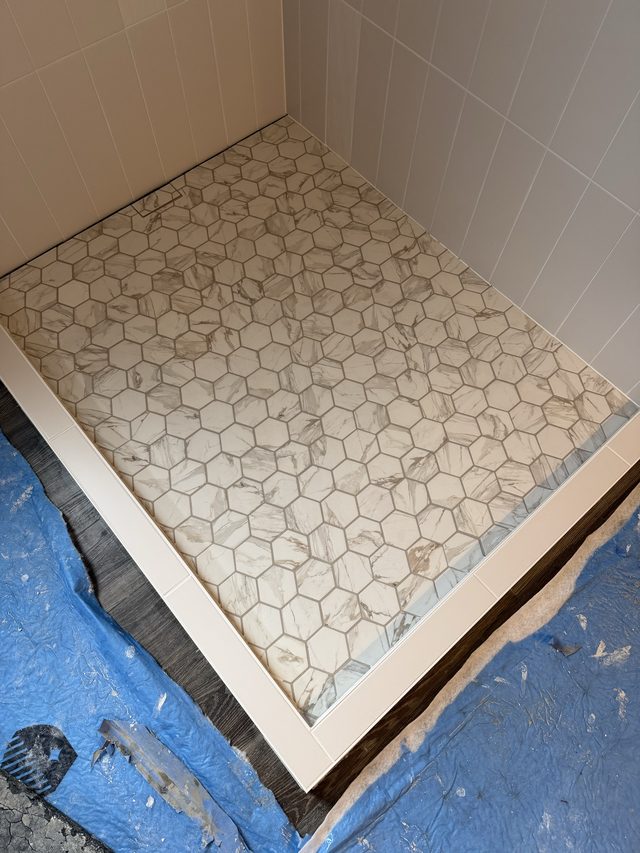 marble hexagon mosaic shower floor close-up