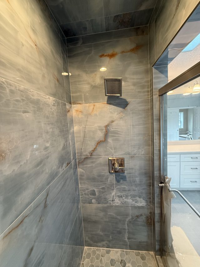 Custom tile bathroom remodel by New Style Construction in Portland