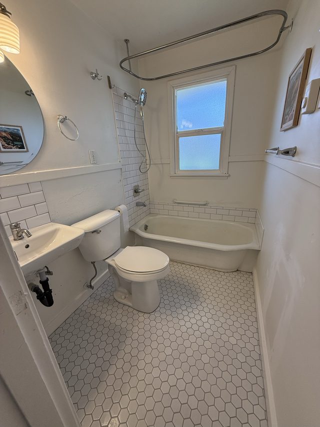 full bathroom with pedestal sink, toilet, tub-shower, hex tile floor