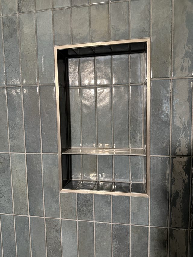 blue tile shower niche close-up