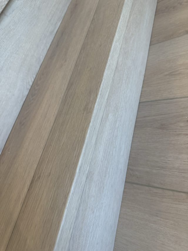 wood flooring planks and stair tread close-up