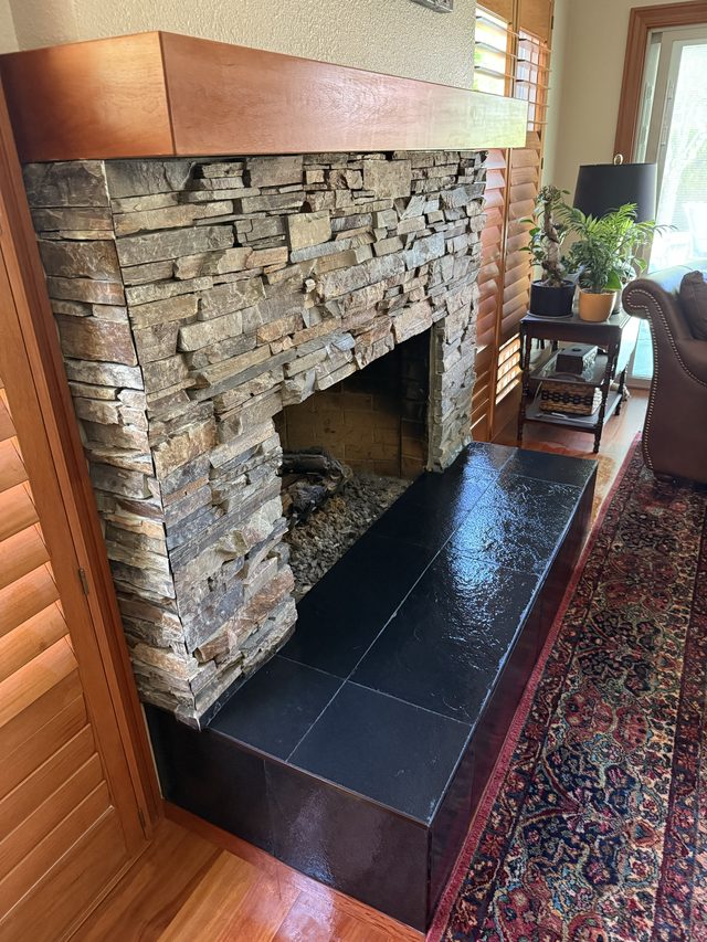 Tile and stone fireplace feature wall
