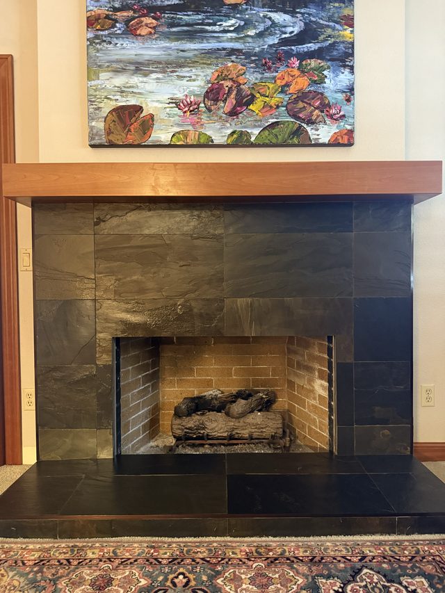 slate-tiled fireplace surround and hearth
