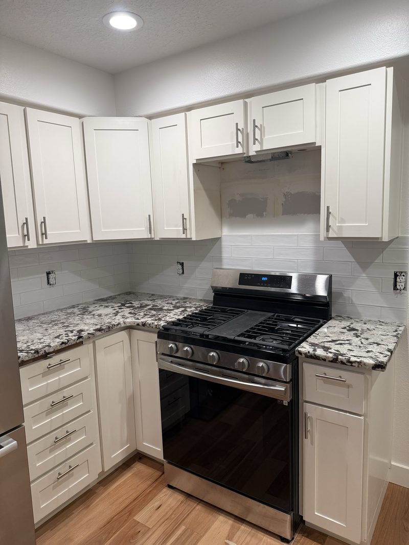 Kitchen remodel with new cabinetry and tile backsplash