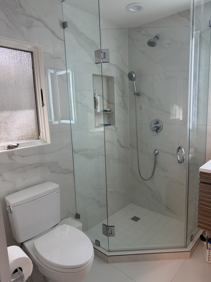 Custom tile walk-in shower with glass enclosure